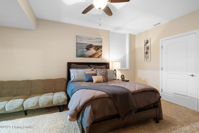 bedroom with carpet flooring, a ceiling fan, and visible vents