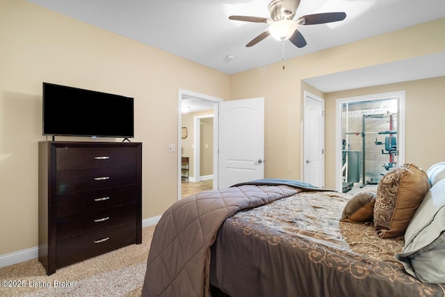 bedroom featuring baseboards, a ceiling fan, and light colored carpet