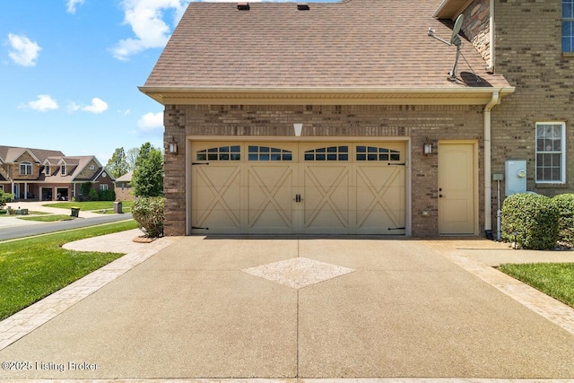 garage featuring aphalt driveway