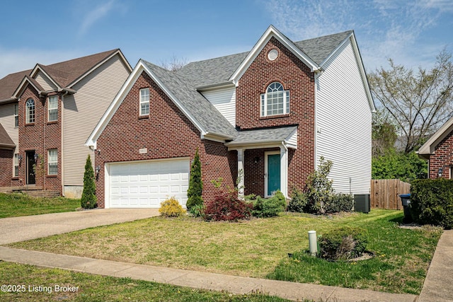 8805 Eli Dr, Louisville, KY 40291 - traditional-style house featuring a front lawn, aphalt driveway, a shingled roof, fence, and a garage
