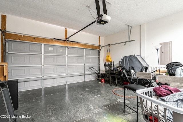 8805 Eli Dr, Louisville, KY 40291 - garage featuring a garage door opener and electric panel