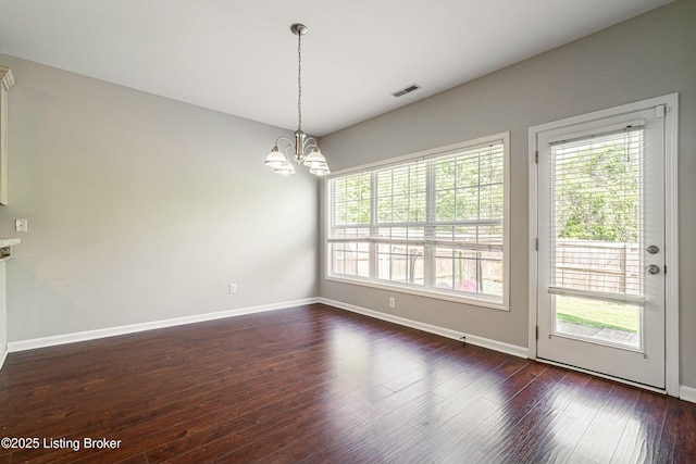 8805 Eli Dr, Louisville, KY 40291 - unfurnished dining area with a chandelier, visible vents, a wealth of natural light, and dark wood-style flooring