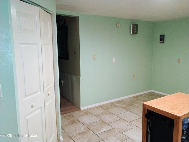 interior space featuring baseboards