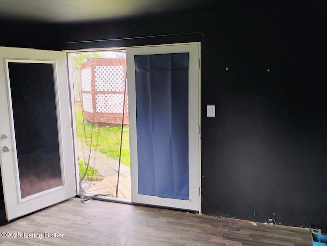 doorway with wood finished floors