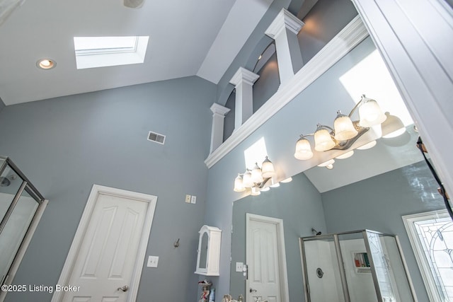 room details featuring visible vents, a skylight, and an inviting chandelier