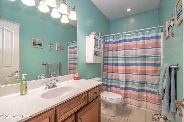 bathroom with toilet, a shower with shower curtain, vanity, and tile patterned floors