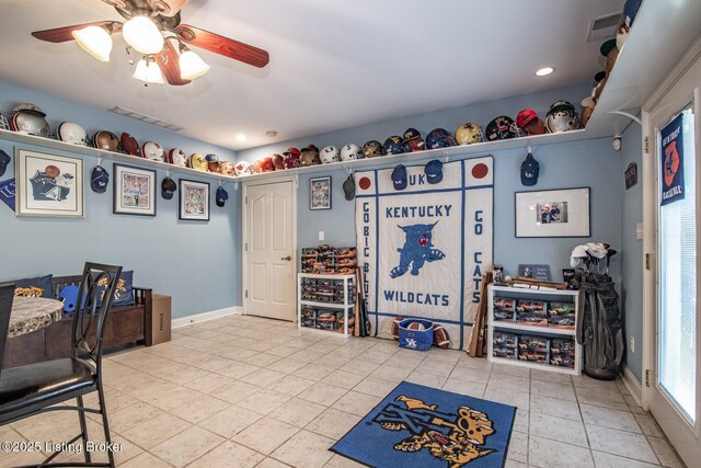 recreation room with visible vents, a ceiling fan, baseboards, and tile patterned floors