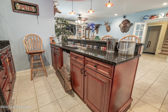 kitchen with a ceiling fan, recessed lighting, light tile patterned floors, and hanging light fixtures