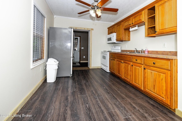 kitchen featuring brown cabinets, crown molding, ceiling fan, white appliances, and dark wood-type flooring