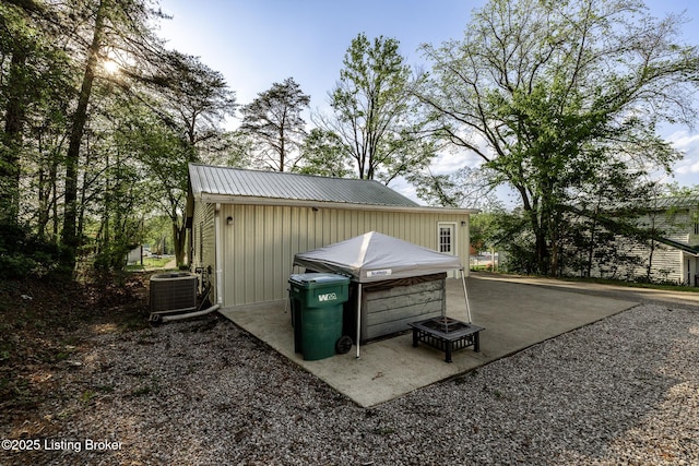 view of outbuilding featuring central AC unit