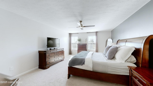bedroom with light carpet, baseboards, and ceiling fan