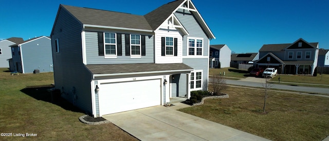 view of front facade with a front lawn, a residential view, an attached garage, driveway, and roof with shingles