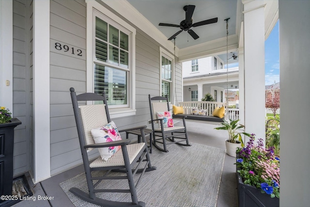 view of patio with a porch and a ceiling fan