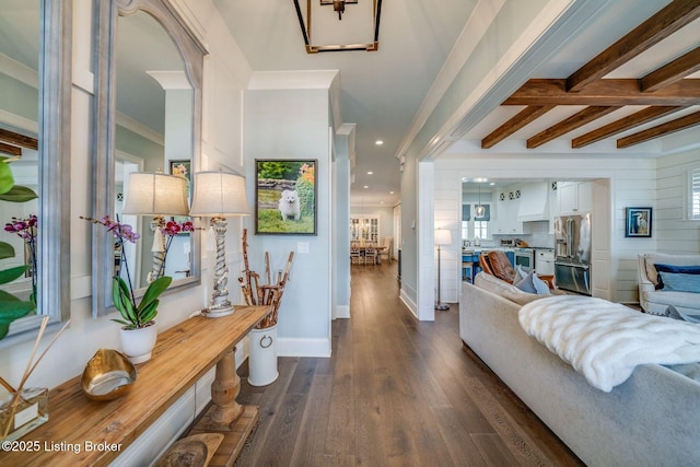 interior space with recessed lighting, ornamental molding, dark wood-type flooring, beamed ceiling, and baseboards