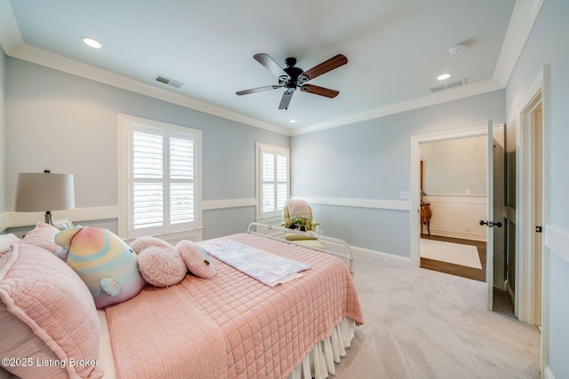 carpeted bedroom featuring visible vents, recessed lighting, and crown molding