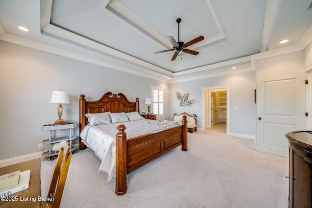bedroom featuring recessed lighting, a tray ceiling, visible vents, light carpet, and baseboards