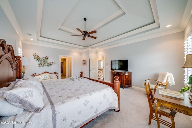 bedroom featuring light colored carpet, multiple windows, and a tray ceiling