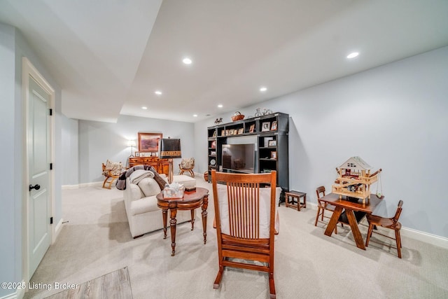 living room with light colored carpet, baseboards, and recessed lighting