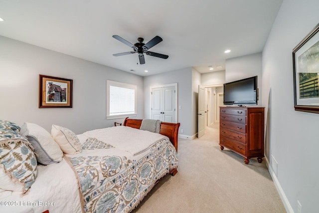 bedroom with recessed lighting, baseboards, a closet, and light colored carpet