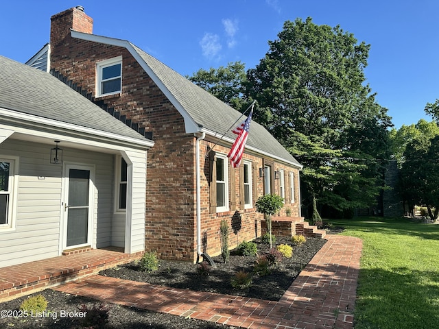 9004 Old Bardstown Rd Rd, Louisville, KY 40291 - view of side of property with a shingled roof, a chimney, a lawn, and brick siding