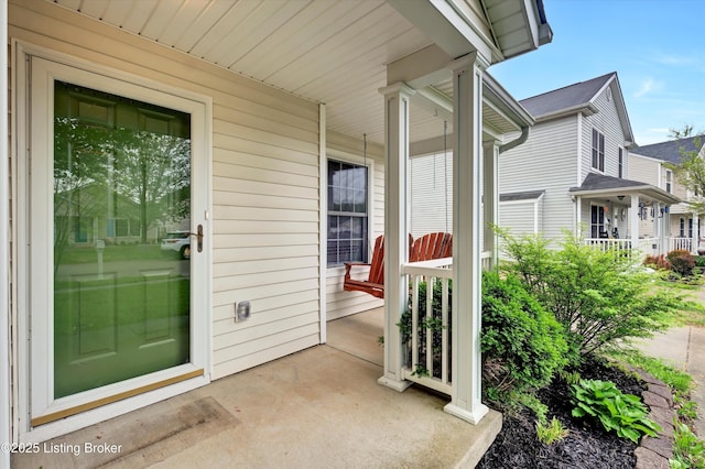 property entrance featuring a porch