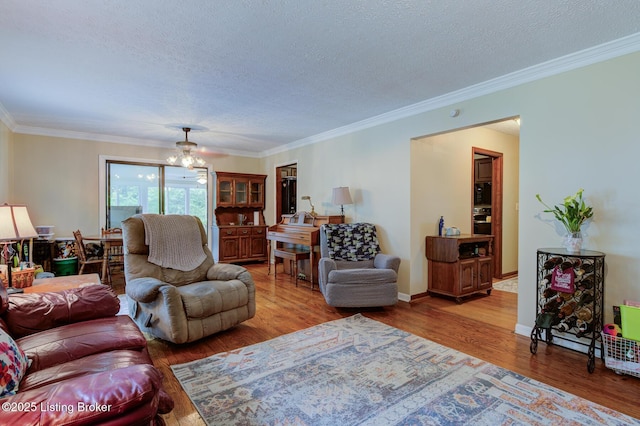 7105 Woodrow Way, Louisville, KY 40228 - living area with wood finished floors, a textured ceiling, ornamental molding, and a chandelier