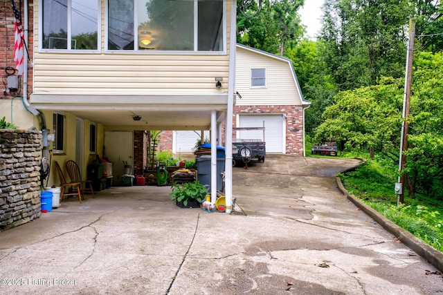 7105 Woodrow Way, Louisville, KY 40228 - garage with driveway and a carport
