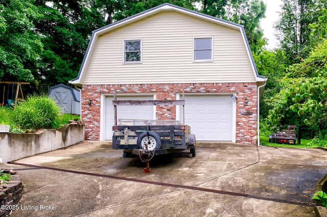 7105 Woodrow Way, Louisville, KY 40228 - garage featuring concrete driveway and a storage unit