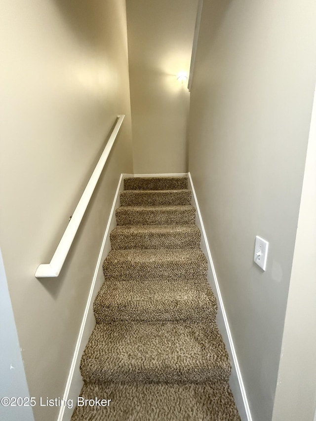 1015 E Muhammad Ali Blvd, Louisville, KY 40204 - staircase with carpet floors and baseboards