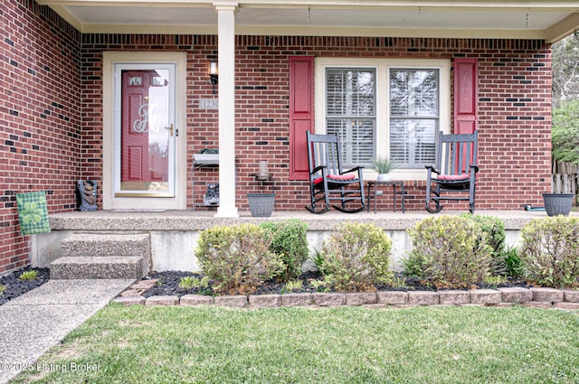 12305 Dominion Way, Louisville, KY 40299 - doorway to property with covered porch and brick siding