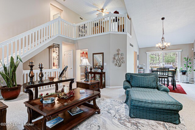 12305 Dominion Way, Louisville, KY 40299 - carpeted living room featuring high vaulted ceiling, baseboards, visible vents, and ceiling fan with notable chandelier