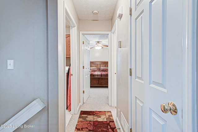 12305 Dominion Way, Louisville, KY 40299 - hallway featuring a textured ceiling and baseboards