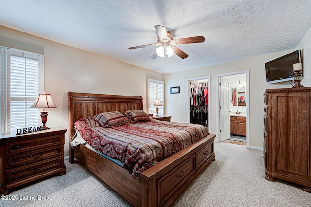 12305 Dominion Way, Louisville, KY 40299 - bedroom with a walk in closet, ceiling fan, a closet, and light carpet