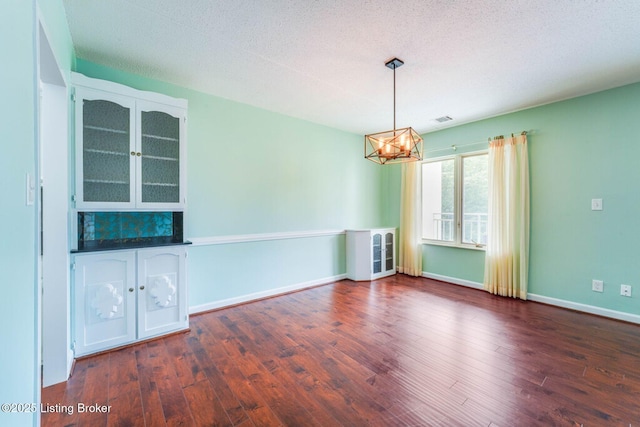 5100 US Highway 42 Unit 226, Louisville, KY 40241 - unfurnished room featuring a chandelier, dark wood-style floors, and baseboards