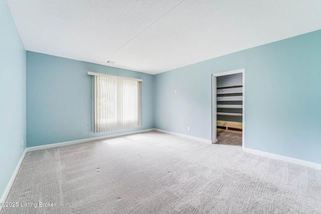 5100 US Highway 42 Unit 226, Louisville, KY 40241 - carpeted spare room with a textured ceiling and baseboards