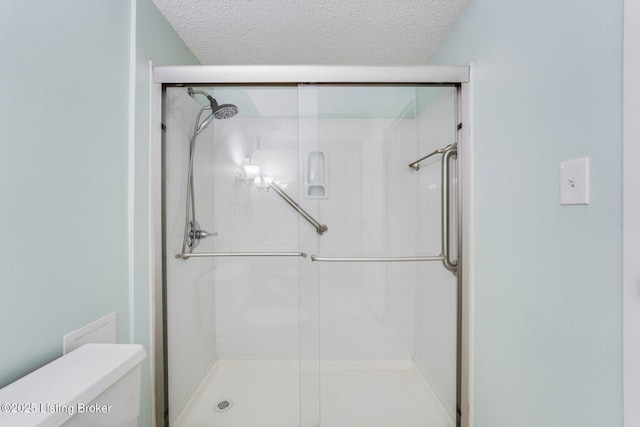 5100 US Highway 42 Unit 226, Louisville, KY 40241 - full bathroom with a textured ceiling, toilet, and a stall shower