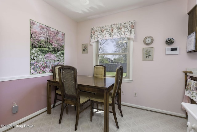 dining area featuring baseboards