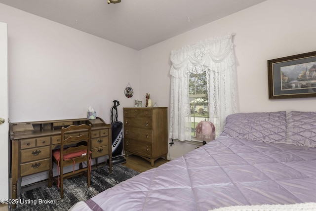 bedroom featuring wood finished floors