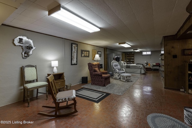 living room with brick patterned floor