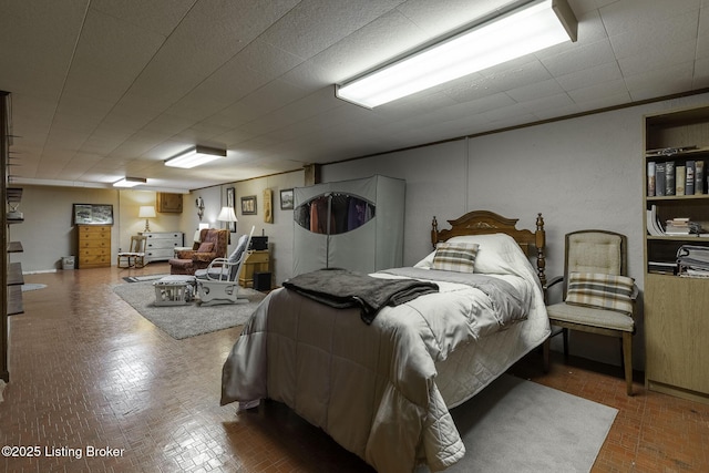 bedroom with brick patterned floor