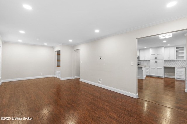 unfurnished living room with recessed lighting, baseboards, crown molding, and dark wood-type flooring