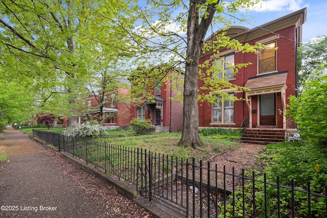 1206 S 6th St, Louisville, KY 40203 - view of front of house featuring brick siding and a fenced front yard