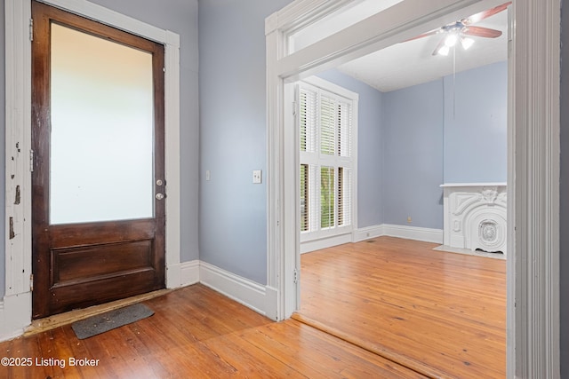 1206 S 6th St, Louisville, KY 40203 - entrance foyer featuring wood-type flooring, a ceiling fan, and baseboards