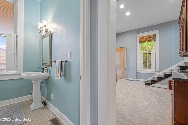 1206 S 6th St, Louisville, KY 40203 - bathroom featuring baseboards, visible vents, recessed lighting, and a sink