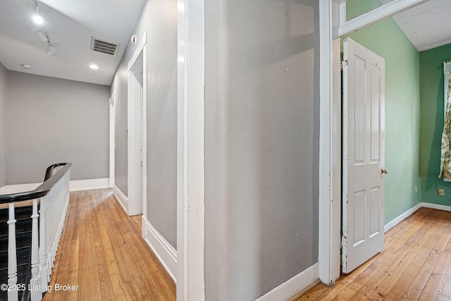 1206 S 6th St, Louisville, KY 40203 - hallway with baseboards, light wood-style floors, and visible vents