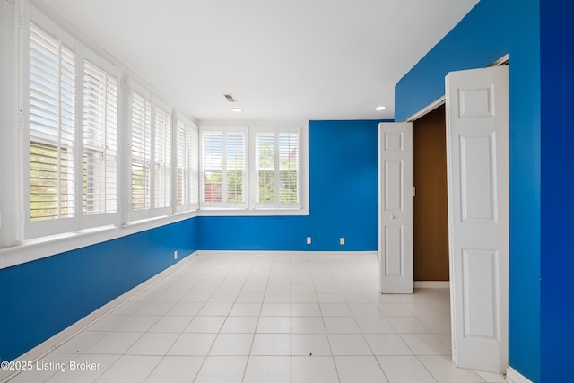1206 S 6th St, Louisville, KY 40203 - tiled spare room with recessed lighting, visible vents, and baseboards