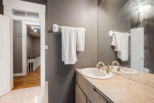 1206 S 6th St, Louisville, KY 40203 - bathroom featuring vanity, baseboards, and tile patterned flooring