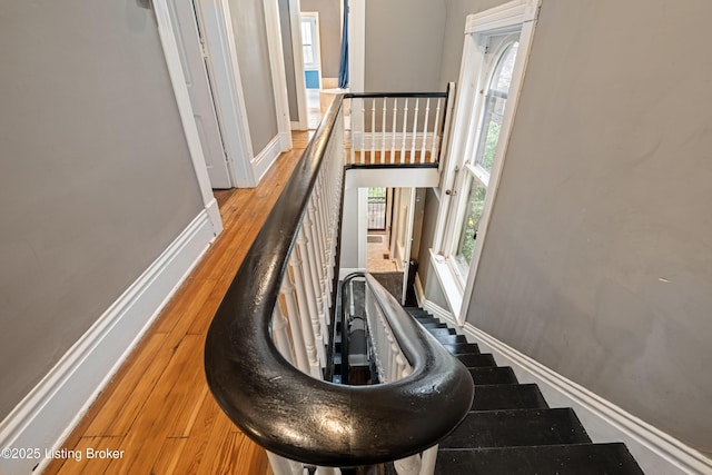 1206 S 6th St, Louisville, KY 40203 - staircase with baseboards and wood finished floors