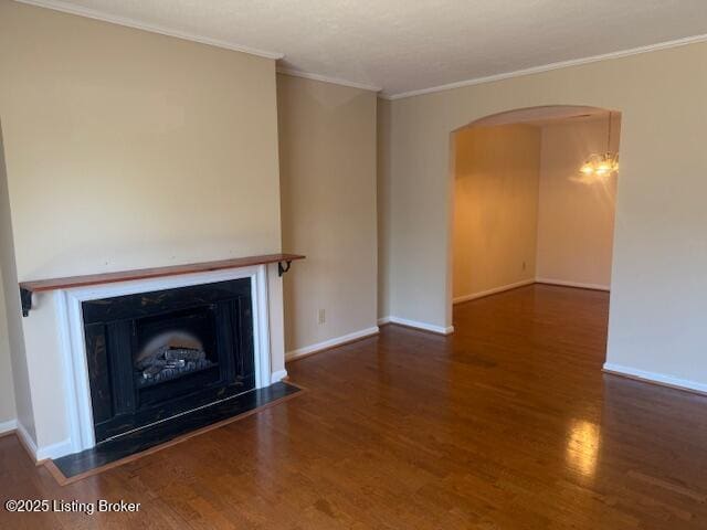 212 La Fontenay Ct, Louisville, KY 40223 - unfurnished living room with crown molding, wood finished floors, baseboards, and arched walkways