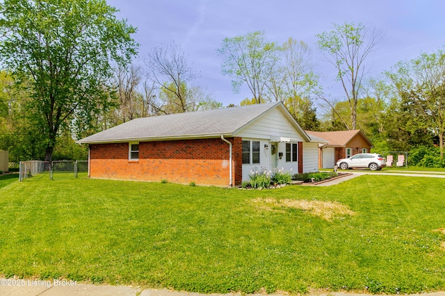 215 Bottorff Dr, Sellersburg, IN 47172 - view of side of home with fence, a lawn, and brick siding